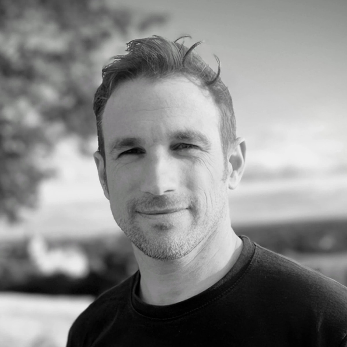 Black and white portrait of Jono Hey outdoors